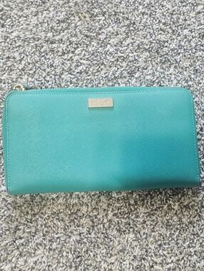 kate spade teal zip-around wallet with gold plaque